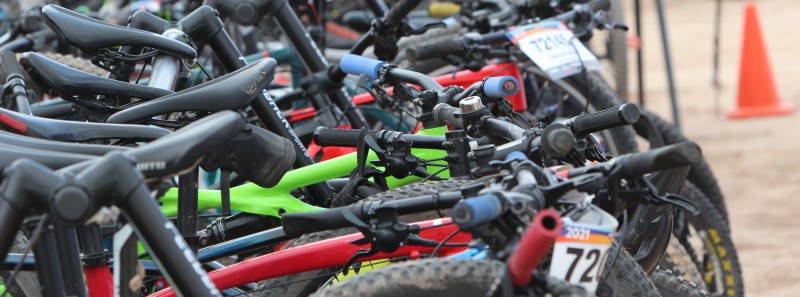 A photo of some bikes lined up and ready to race.