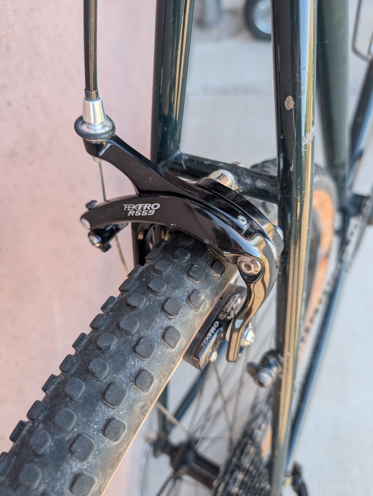 Close-up of the Tektro rim brake and knobby gravel tire